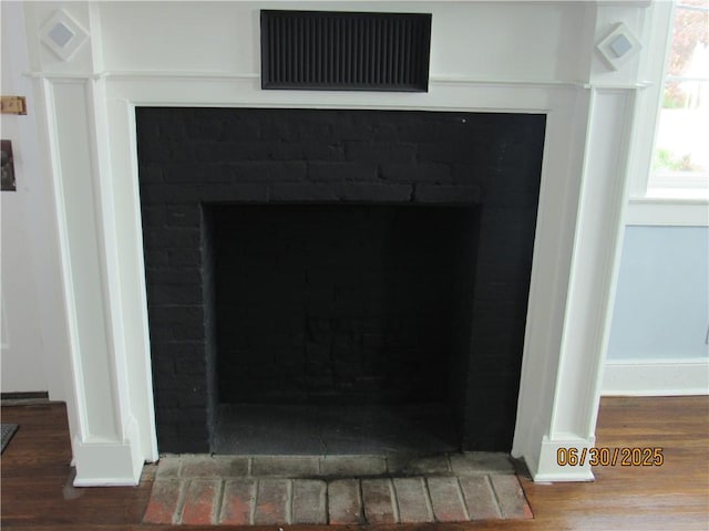 4 Geneva St, Lyons, NY 14489 - detailed view of a brick fireplace and wood finished floors