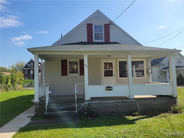 465 18th St, Niagara Falls, NY 14303 - bungalow-style house with a porch, a front yard, and a shingled roof
