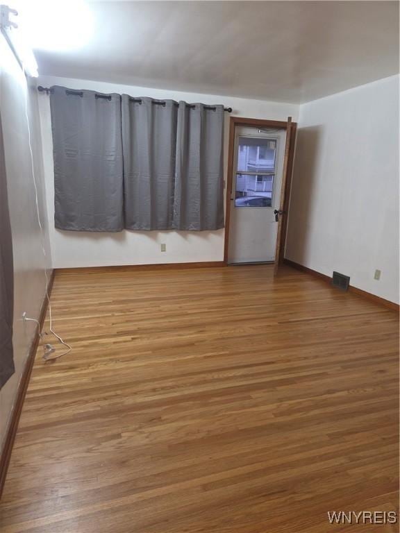 465 18th St, Niagara Falls, NY 14303 - spare room with wood finished floors