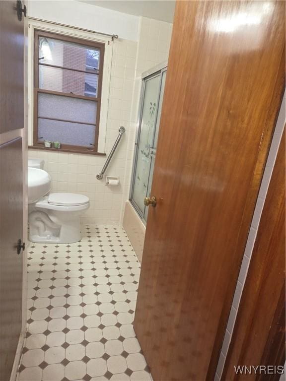 465 18th St, Niagara Falls, NY 14303 - full bathroom featuring tile walls, tile patterned floors, and shower / bath combination with glass door