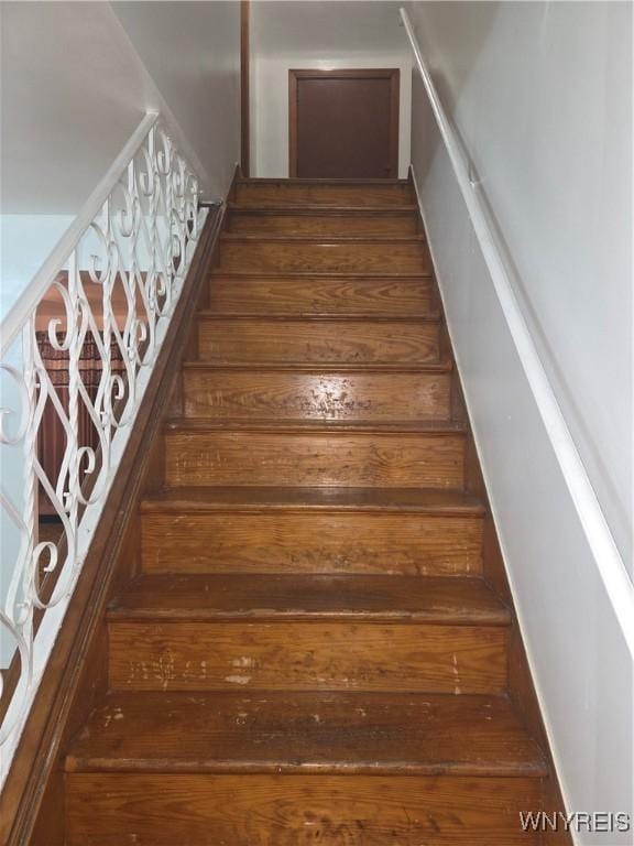 465 18th St, Niagara Falls, NY 14303 - staircase featuring hardwood / wood-style flooring