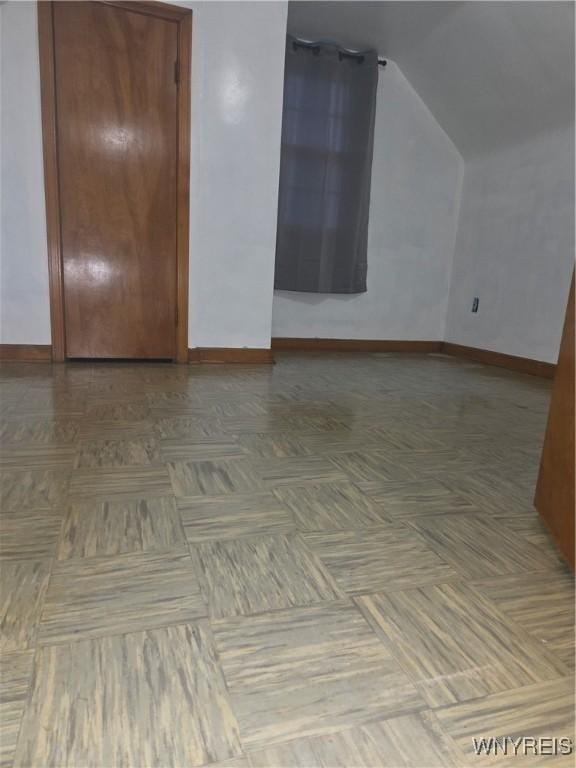 465 18th St, Niagara Falls, NY 14303 - unfurnished room featuring baseboards and lofted ceiling