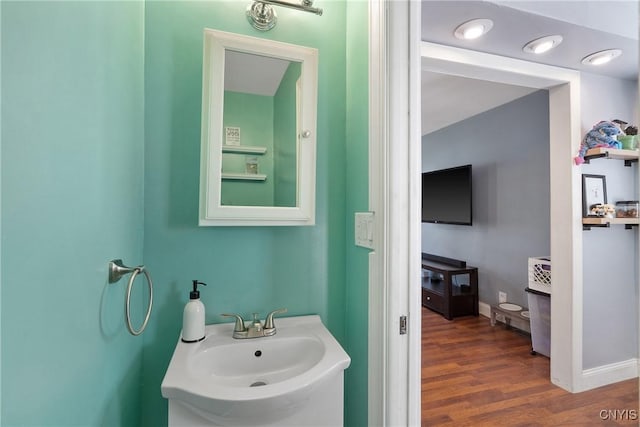 230 Thieme Pl, Utica, NY 13502 - bathroom featuring a sink and wood finished floors