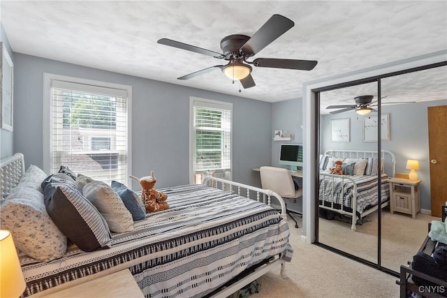 230 Thieme Pl, Utica, NY 13502 - bedroom with light carpet, a closet, and a ceiling fan