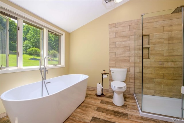 3200 Ransom Rd, Pompey, NY 13078 - full bathroom featuring lofted ceiling, a stall shower, wood finished floors, and a freestanding bath