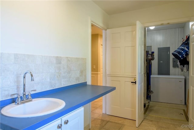 3200 Ransom Rd, Pompey, NY 13078 - bathroom with tile patterned floors, tasteful backsplash, electric panel, and vanity