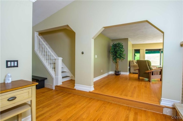 3200 Ransom Rd, Pompey, NY 13078 - entryway featuring light wood-style flooring, arched walkways, and stairs