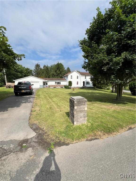 11 Canal St, Mentz, NY 13140 - view of front of house with asphalt driveway and a front yard