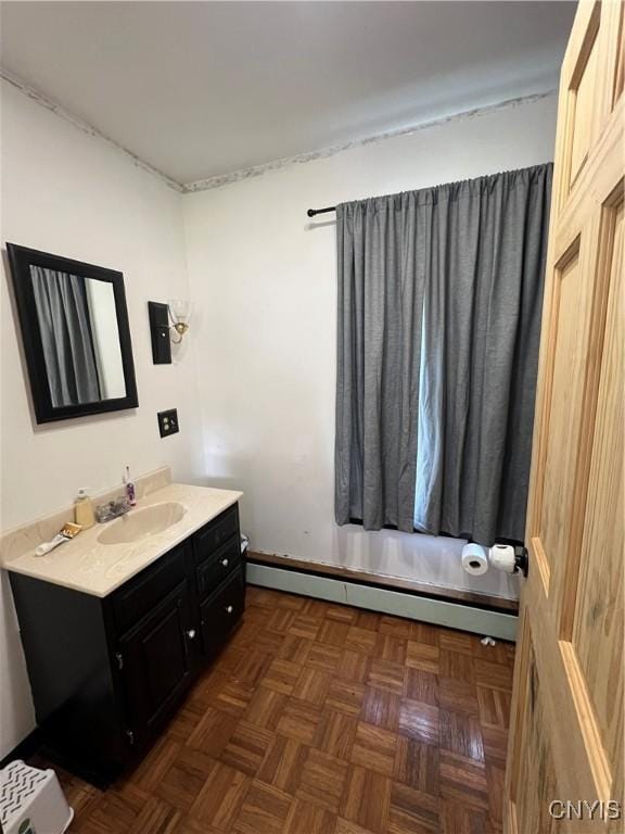 11 Canal St, Mentz, NY 13140 - bathroom featuring a baseboard radiator and vanity