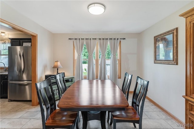 4024 Bond St, Hamburg, NY 14219 - dining area with light tile patterned flooring and baseboards