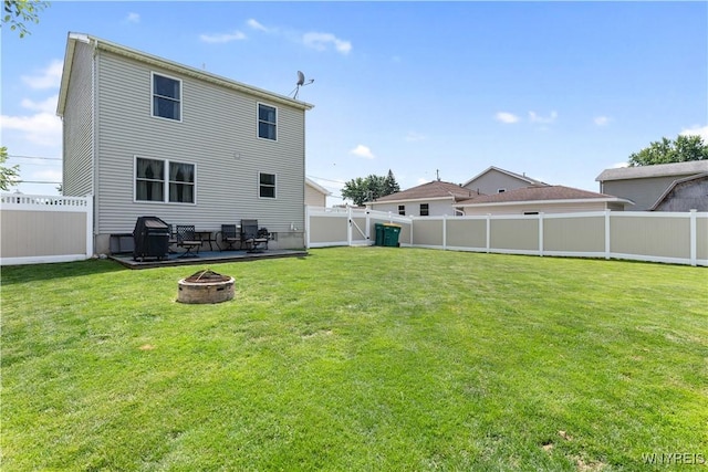 4024 Bond St, Hamburg, NY 14219 - rear view of house featuring an outdoor fire pit, a fenced backyard, and a gate