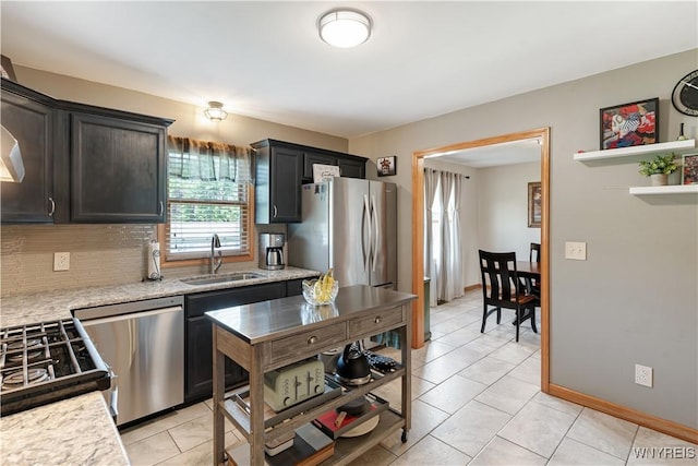 4024 Bond St, Hamburg, NY 14219 - kitchen featuring stainless steel appliances, plenty of natural light, decorative backsplash, and light tile patterned floors