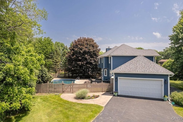 3306 Glen Abbey, Lysander, NY 13135 - view of front facade with driveway, a garage, roof with shingles, and a chimney