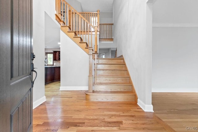 3306 Glen Abbey, Lysander, NY 13135 - foyer featuring light wood-style floors, stairway, and a high ceiling