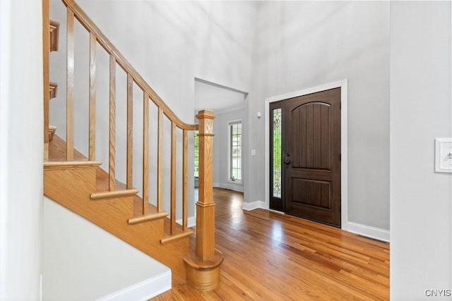 3306 Glen Abbey, Lysander, NY 13135 - foyer entrance featuring wood finished floors, stairs, and a high ceiling