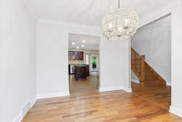 3306 Glen Abbey, Lysander, NY 13135 - unfurnished dining area with stairway, a chandelier, ornamental molding, and light wood finished floors