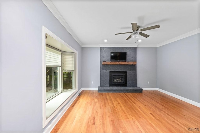 3306 Glen Abbey, Lysander, NY 13135 - unfurnished living room with ceiling fan, crown molding, a fireplace, light wood-type flooring, and recessed lighting