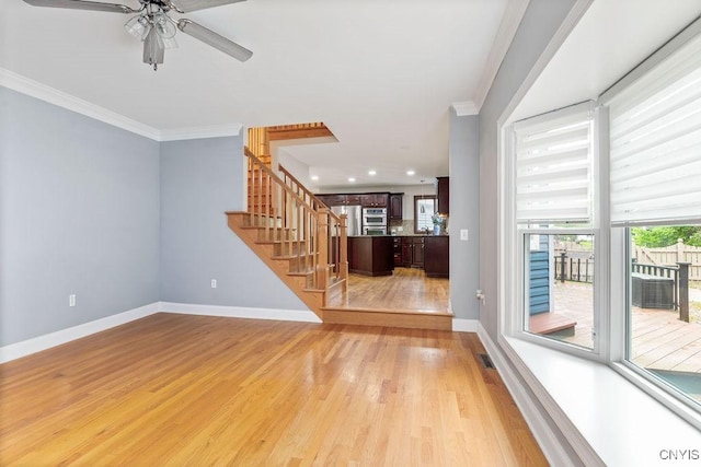3306 Glen Abbey, Lysander, NY 13135 - unfurnished living room featuring stairs, ornamental molding, a ceiling fan, light wood-type flooring, and recessed lighting