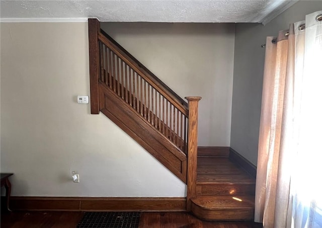 914 Magee St, Elmira City, NY 14901 - stairs with wood finished floors and a textured ceiling