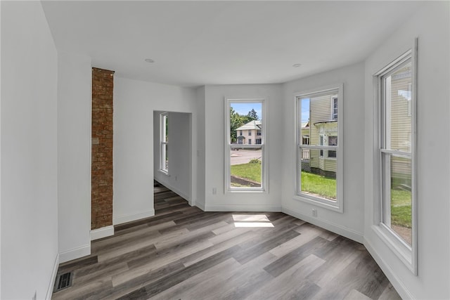503 Main St, Oneonta, NY 13820 - spare room featuring wood finished floors