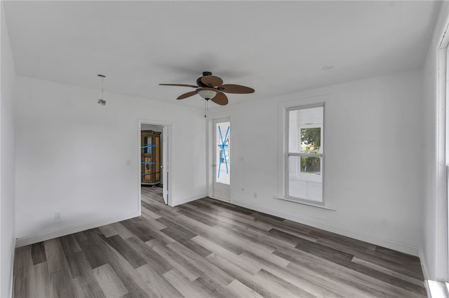 503 Main St, Oneonta, NY 13820 - empty room with wood finished floors and ceiling fan