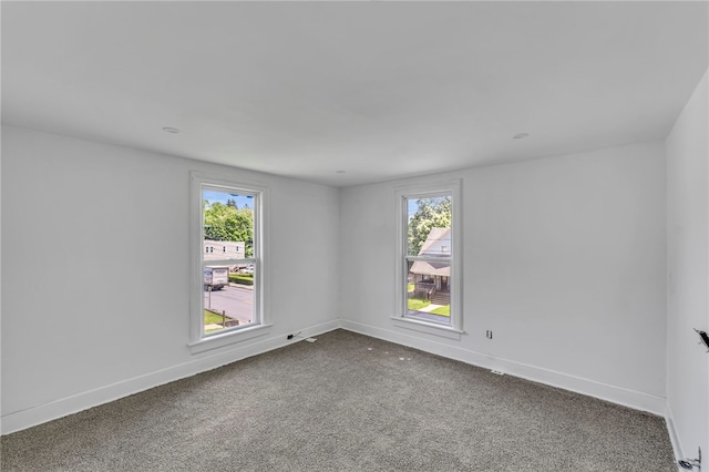 503 Main St, Oneonta, NY 13820 - unfurnished room with dark carpet and baseboards