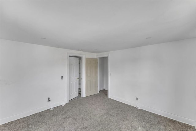 503 Main St, Oneonta, NY 13820 - carpeted empty room with baseboards