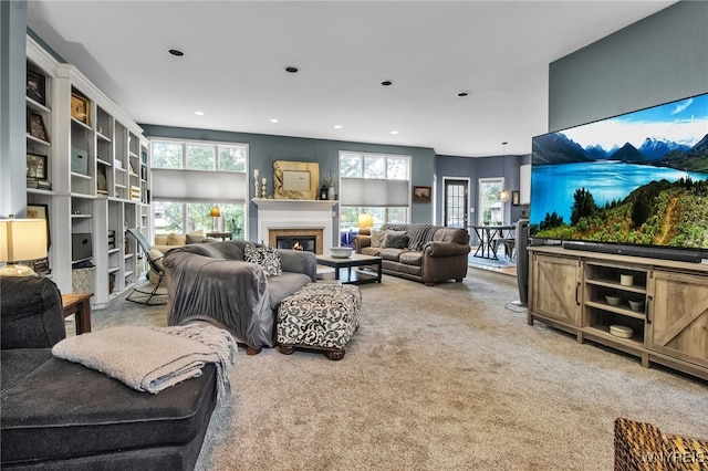 152 Pino Verde Ln, Amherst, NY 14221 - carpeted living area featuring a glass covered fireplace and recessed lighting
