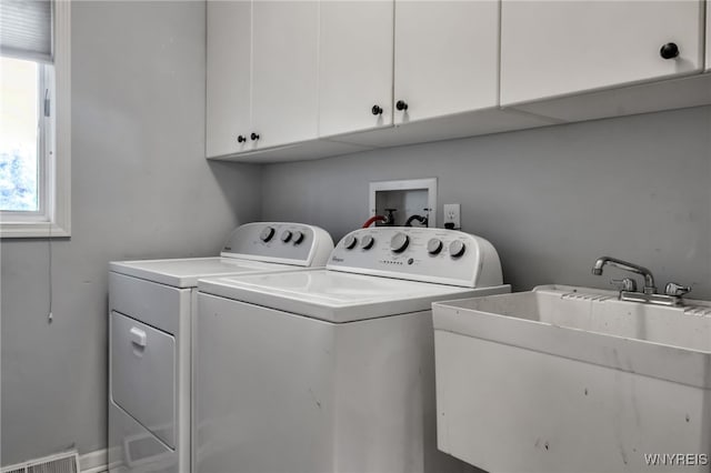 152 Pino Verde Ln, Amherst, NY 14221 - laundry area featuring cabinet space, separate washer and dryer, and plenty of natural light