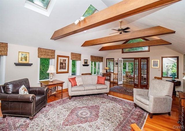 1929 Chard Rd, Cazenovia, NY 13035 - living room with wood finished floors, a skylight, and a ceiling fan