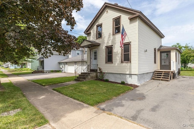 81 E 10th St, Oswego, NY 13126 - view of front of home featuring a front lawn