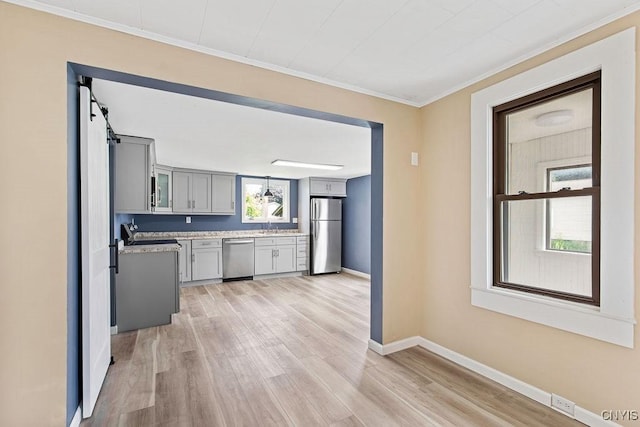 81 E 10th St, Oswego, NY 13126 - kitchen featuring appliances with stainless steel finishes, gray cabinets, light countertops, light wood-type flooring, and crown molding