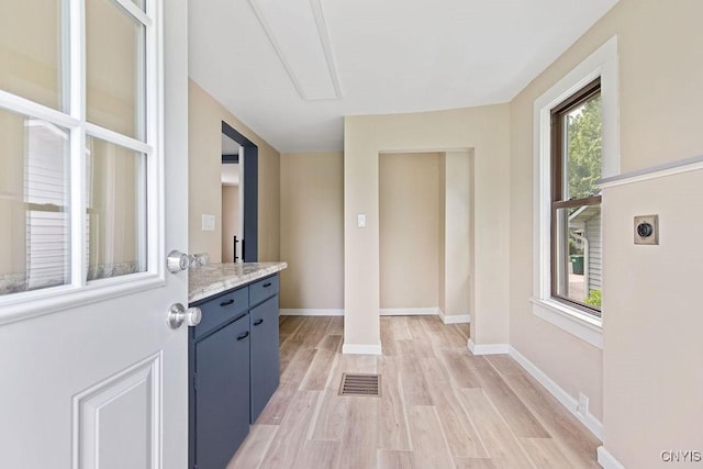 81 E 10th St, Oswego, NY 13126 - foyer entrance with light wood-type flooring and baseboards
