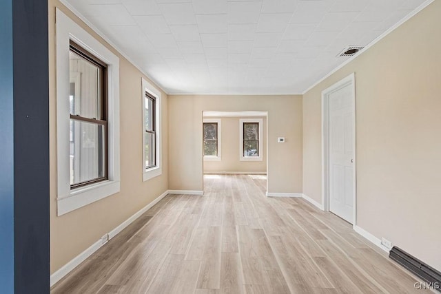 81 E 10th St, Oswego, NY 13126 - empty room featuring light wood-style floors and crown molding