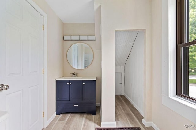 81 E 10th St, Oswego, NY 13126 - bathroom featuring wood finished floors and vanity