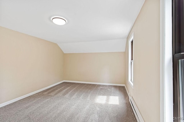 81 E 10th St, Oswego, NY 13126 - additional living space featuring a baseboard heating unit, lofted ceiling, and carpet flooring