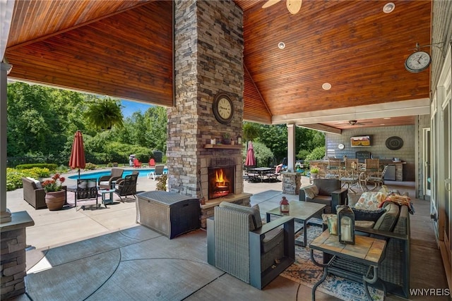 4614 Vrooman Dr, Lewiston, NY 14092 - view of patio / terrace featuring an outdoor living space with a fireplace, a ceiling fan, an outdoor pool, and outdoor dining space
