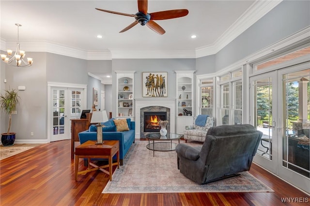 4614 Vrooman Dr, Lewiston, NY 14092 - living area with french doors, wood finished floors, crown molding, a warm lit fireplace, and ceiling fan