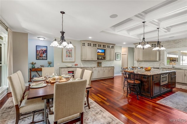 4614 Vrooman Dr, Lewiston, NY 14092 - dining space featuring a chandelier, dark wood-style flooring, coffered ceiling, recessed lighting, and beam ceiling