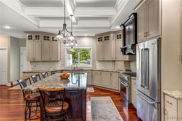 4614 Vrooman Dr, Lewiston, NY 14092 - kitchen featuring high quality appliances, a center island with sink, ornamental molding, coffered ceiling, and light stone counters