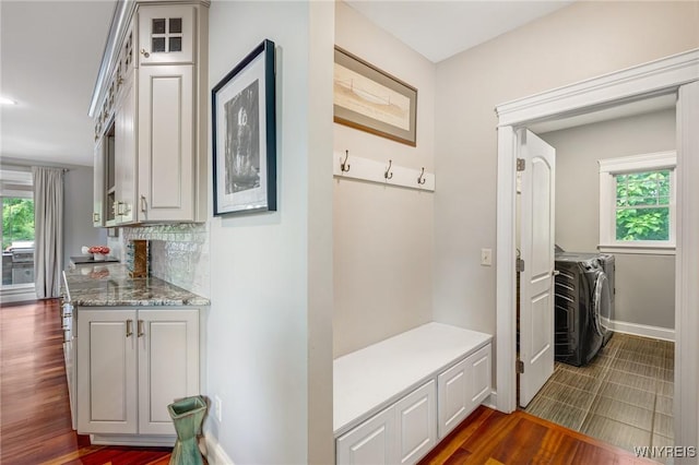 4614 Vrooman Dr, Lewiston, NY 14092 - mudroom with washing machine and clothes dryer and dark wood finished floors