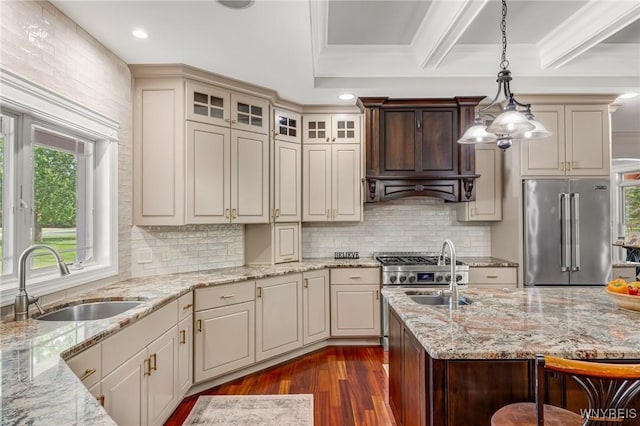 4614 Vrooman Dr, Lewiston, NY 14092 - kitchen with premium appliances, dark wood-style floors, light stone countertops, hanging light fixtures, and recessed lighting