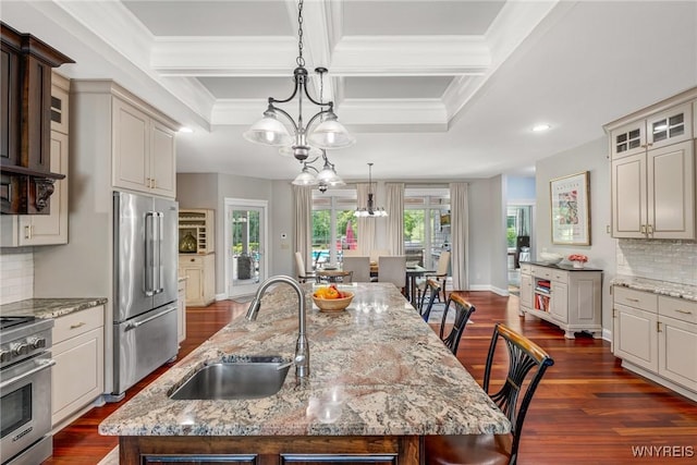 4614 Vrooman Dr, Lewiston, NY 14092 - kitchen featuring high quality appliances, a center island with sink, recessed lighting, dark wood-type flooring, and backsplash
