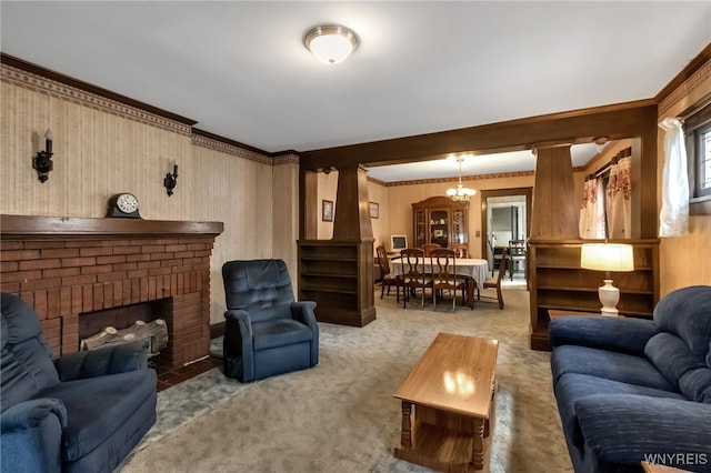 53 Pine Rdg, Cheektowaga, NY 14225 - living room featuring light colored carpet, ornamental molding, a brick fireplace, and a chandelier