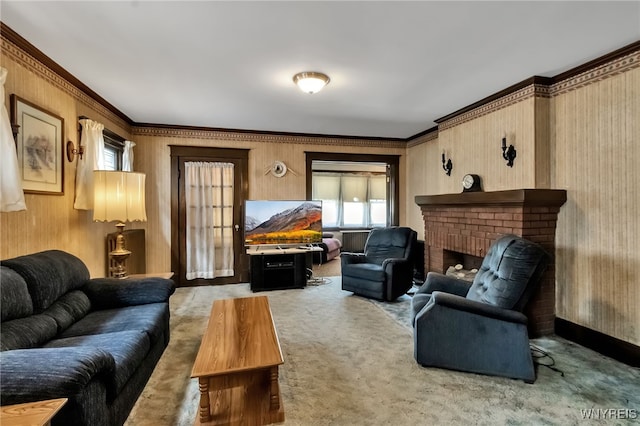 53 Pine Rdg, Cheektowaga, NY 14225 - living room featuring carpet floors, a fireplace, ornamental molding, and wooden walls