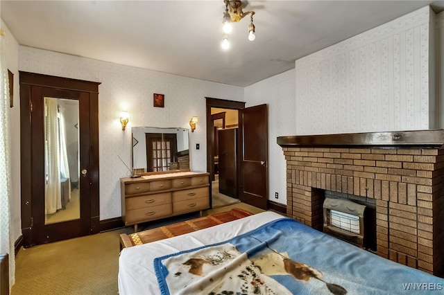 53 Pine Rdg, Cheektowaga, NY 14225 - bedroom featuring a brick fireplace, wallpapered walls, and light carpet