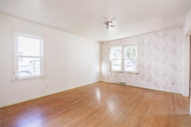 232 W Ivy St, East Rochester, NY 14445 - spare room with light wood-style flooring and wallpapered walls