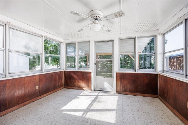 232 W Ivy St, East Rochester, NY 14445 - unfurnished sunroom with tile patterned floors and wood walls