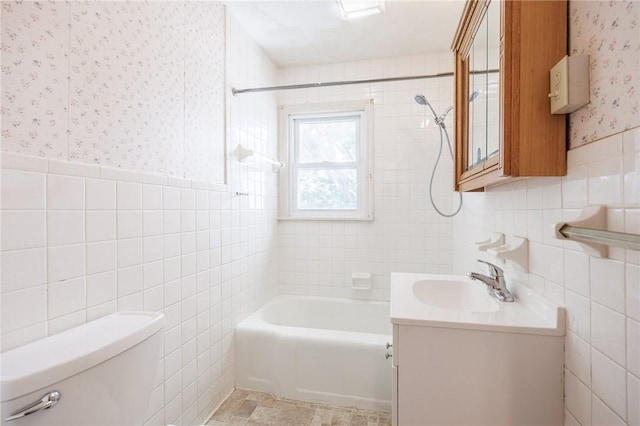 232 W Ivy St, East Rochester, NY 14445 - bathroom featuring tile walls, wallpapered walls, vanity, bathing tub / shower combination, and a wainscoted wall