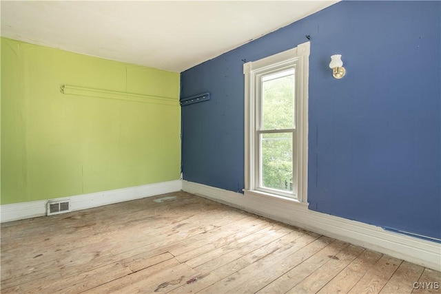 662 Burchard St, Watertown City, NY 13601 - empty room with hardwood / wood-style flooring and plenty of natural light